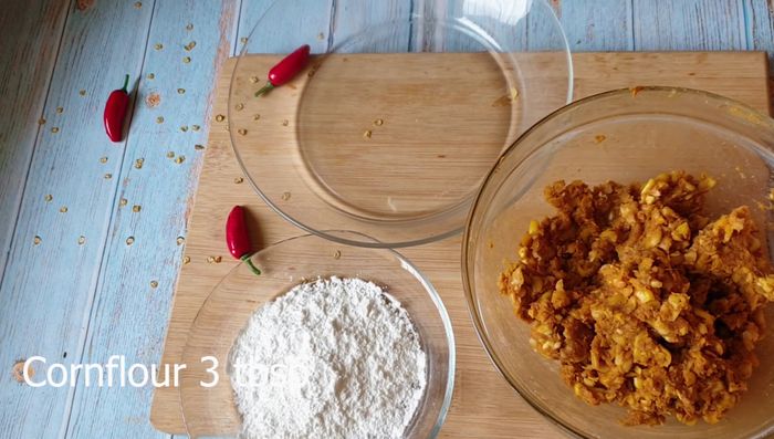 Take small portions of the dough and shape them into round patties or fritters.