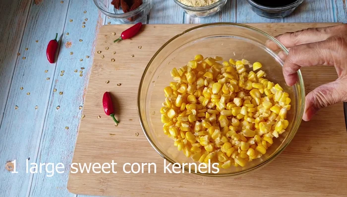 Chop boiled sweet corn kernels into a mushy form.