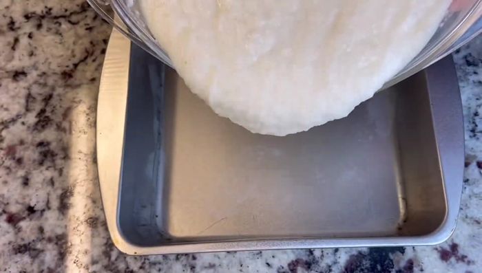 Pour the mixture into the baking pan.