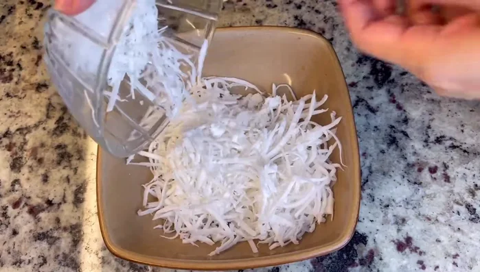 While the cassava is steaming, place shredded coconut in a bowl and steam separately for 10-15 minutes.