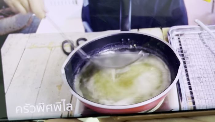 Prepare the Foi Thong (egg yolk topping): Heat sugar until it becomes liquid.