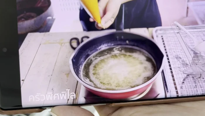Add egg yolks in a circular motion to the heated sugar.