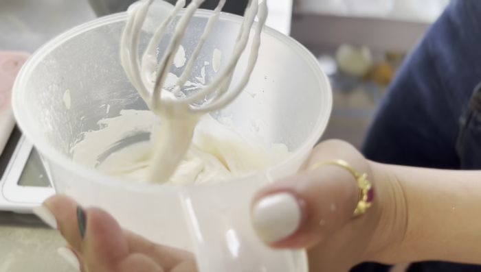 Add the cooled Foi Thong (egg yolk topping) on top of the cake batter.