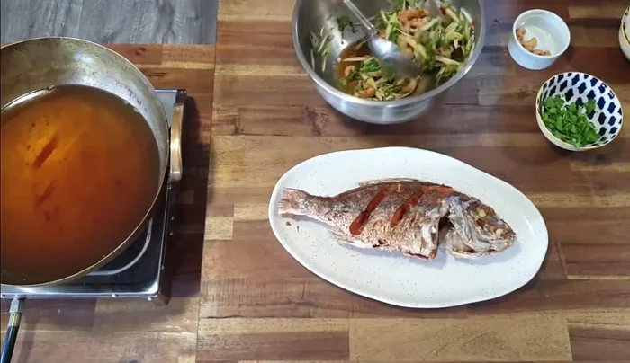 Serve the crispy snapper with the green mango salad.