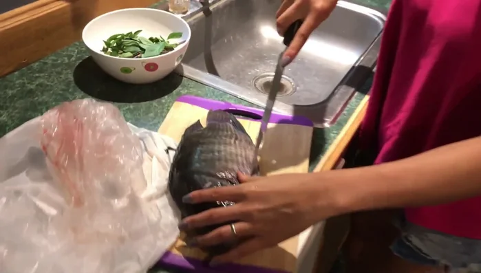 Add the tilapia fillets to the pan and cook until they are cooked through. (Note: Cooking time is not detailed)