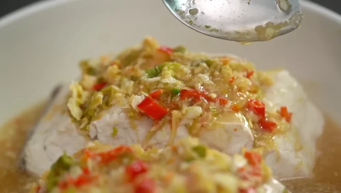 Spoon sauce over the fish and serve.
