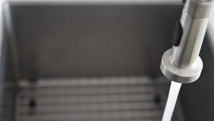 Boil a pot of water. Prepare lettuce and herbs by washing and spinning them dry using a salad spinner.