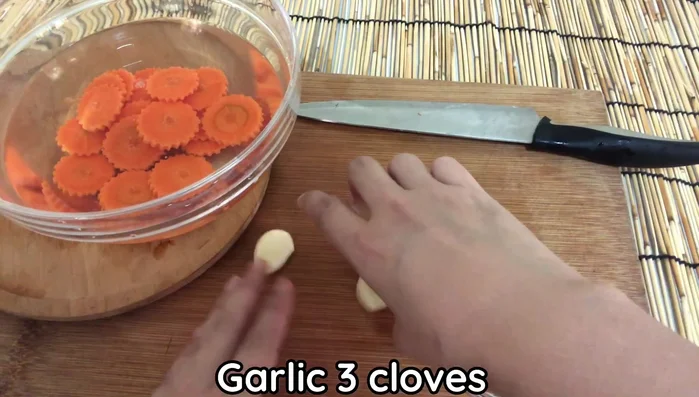 Prepare the garlic and chili: Crush 3 cloves of garlic and slice 3 pieces of red chili (adjust to your spice preference).