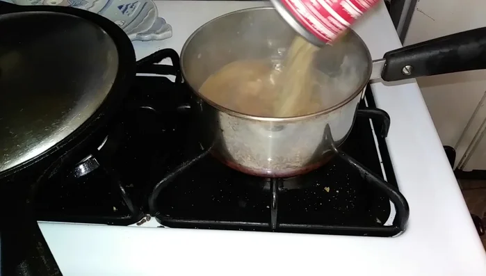 Heat the soup on the stove.