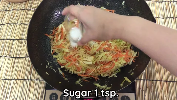 Add salt, sugar, and soy sauce. Fry until well combined.