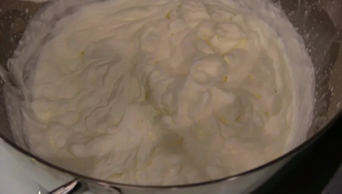 Whip whipping cream to stiff peaks.
