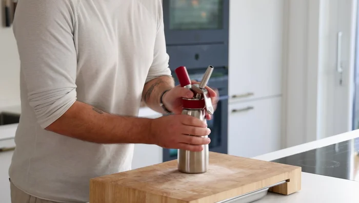 Pour into a siphon, charge, shake, and refrigerate for at least 30 minutes.