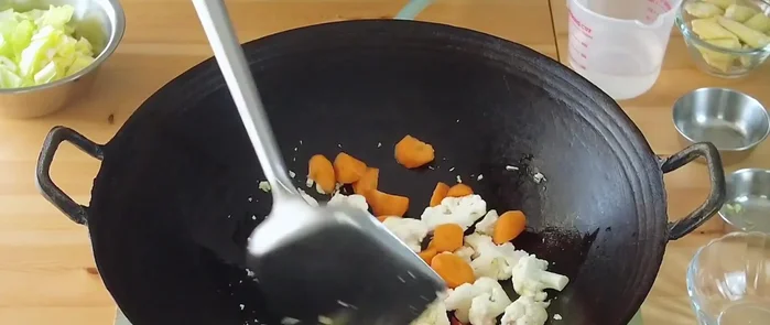 Add Group 1 vegetables and cook for about 2 minutes, adding a little water to help them cook through.