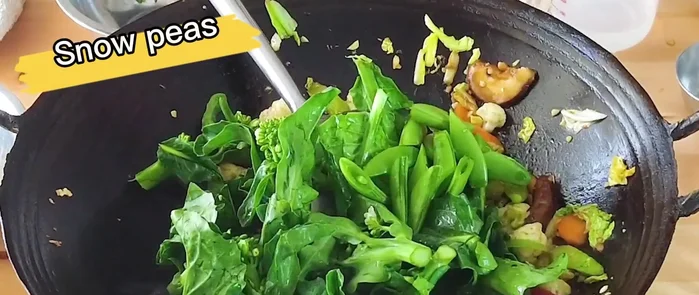 Add Group 3 vegetables and cook until the leaves wilt (about 1 minute).