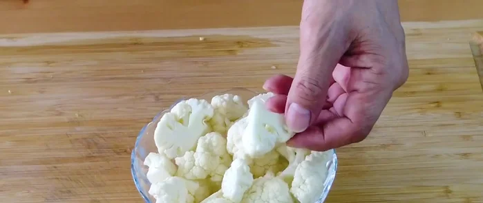 Prepare the vegetables: Cut cauliflower into small florets, carrots into wedges, snow peas in half, baby corn into smaller pieces, cabbage into pieces, rehydrated dried shiitake mushrooms into pieces, and separate Chinese broccoli leaves from stems, slicing stems thinly.