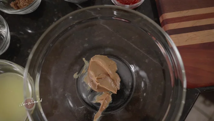 Prepare the Pad Thai sauce: Combine peanut butter, sambal, brown sugar, soy sauce, white vinegar, apple cider vinegar, and stock in a bowl. Whisk until well combined (some separation is okay).