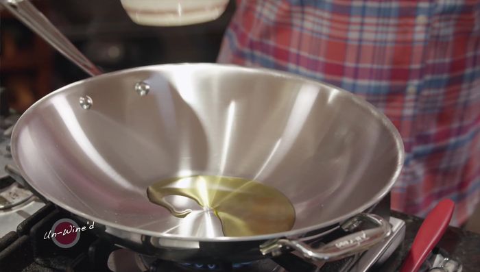 Warm a pan and add 1 tablespoon of olive oil. Add grated carrots and stir-fry until slightly softened.