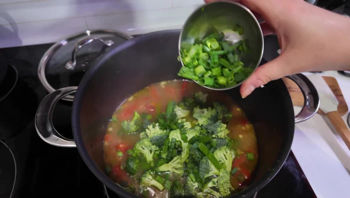 Add broccoli florets, remaining green onions, coconut milk, and coconut sugar. Stir well and cook until broccoli is bright green (2-3 minutes).