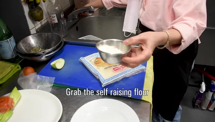 Fold the wrapper over the prawn, using a little water to seal the edges. (228.48)