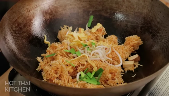 Add the remaining ingredients: Add the tofu, shrimp, and remaining egg ribbons. Toss gently to combine. Add more vegetables if desired.