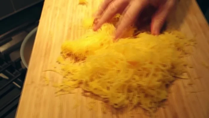 Add the shredded spaghetti squash and stir to coat.