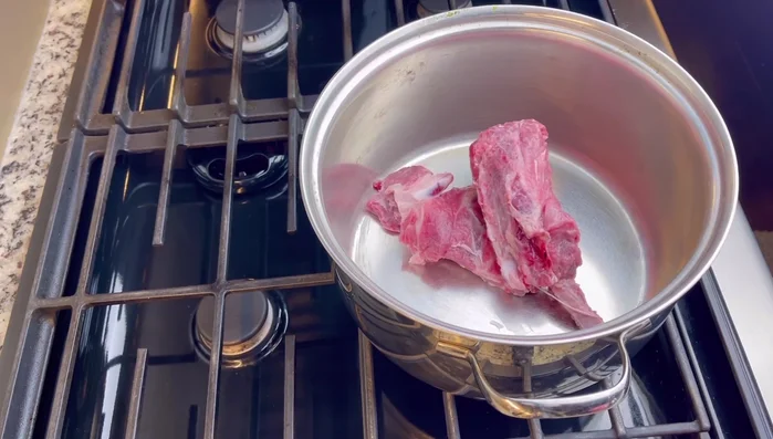 In a large pot, combine pork neck bones, herbs (in cheesecloth bag), rock sugar, daikon radish, and water. Bring to a boil, then reduce heat to medium and simmer for at least 2 hours (3-4 hours is better). Skim off fat frequently.