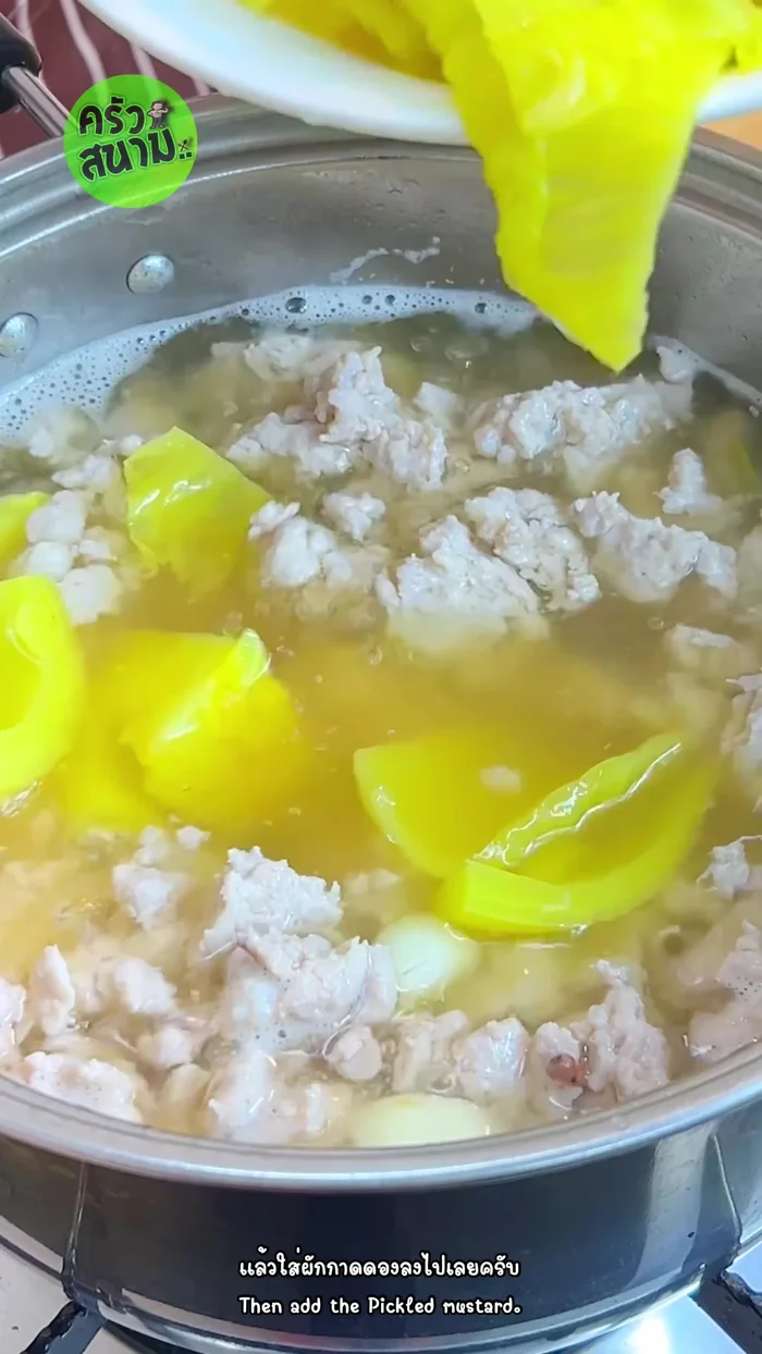 Add pickled cabbage: Add the pickled cabbage, pressing it into the water. Bring the water back to a boil and skim off any foam.