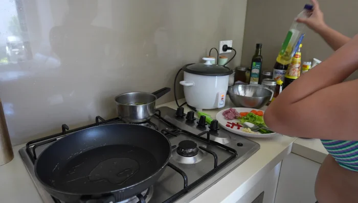 Heat vegetable oil in a wok or frying pan.