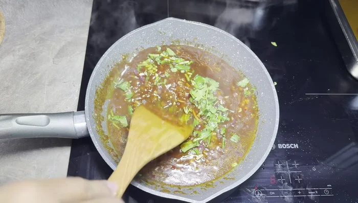 Garnish with fresh coriander and lime juice.