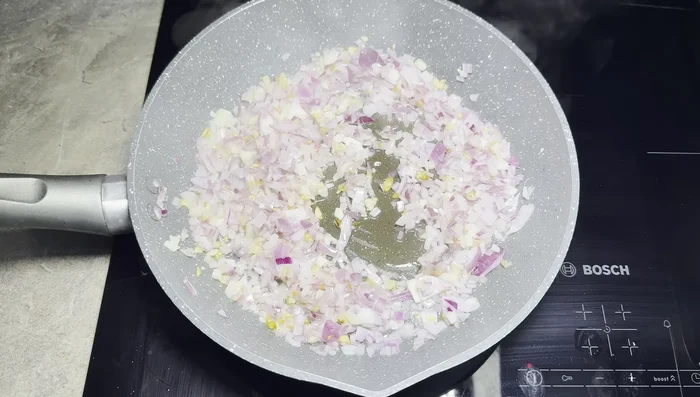 Add onion, lime leaves, ginger, sweet chili sauce, dark soy sauce, and fish sauce to the pan.