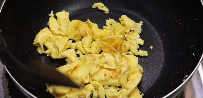 Push the mushrooms to one side of the pan. Pour in the whisked eggs and scramble gently.