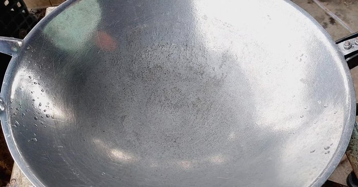 Start stir-frying. Add oil to the wok.
