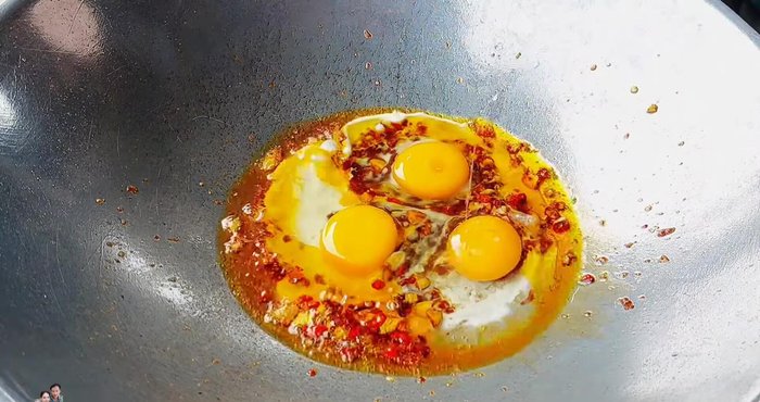 Cook eggs over low heat, gently stirring to prevent sticking. Cook egg yolk to your desired doneness.