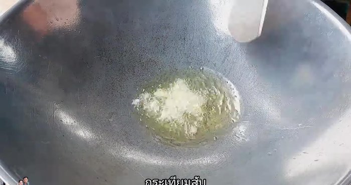 Add chopped garlic and stir-fry until fragrant.