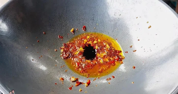 Add oyster sauce, soy sauce, seasoning, and a little fish sauce. Stir-fry gently.