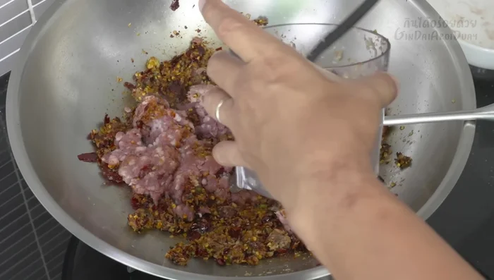 Add minced pork. Stir-fry and break up any clumps. Add a little water if needed.