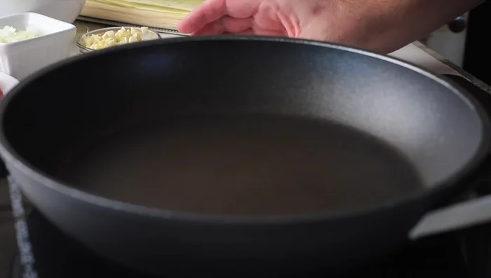 Heat 2 tablespoons of coconut oil in a frying pan over medium heat. Slice beef thinly and cook until lightly browned (medium rare). Remove from pan.
