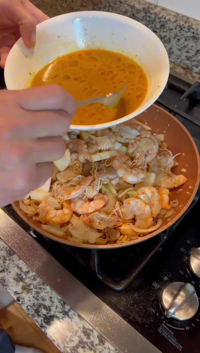 Add sauce and seasonings: Add the prepared sauce, white pepper, and stir well. If using, add kaffir lime leaves (can be torn or chopped).