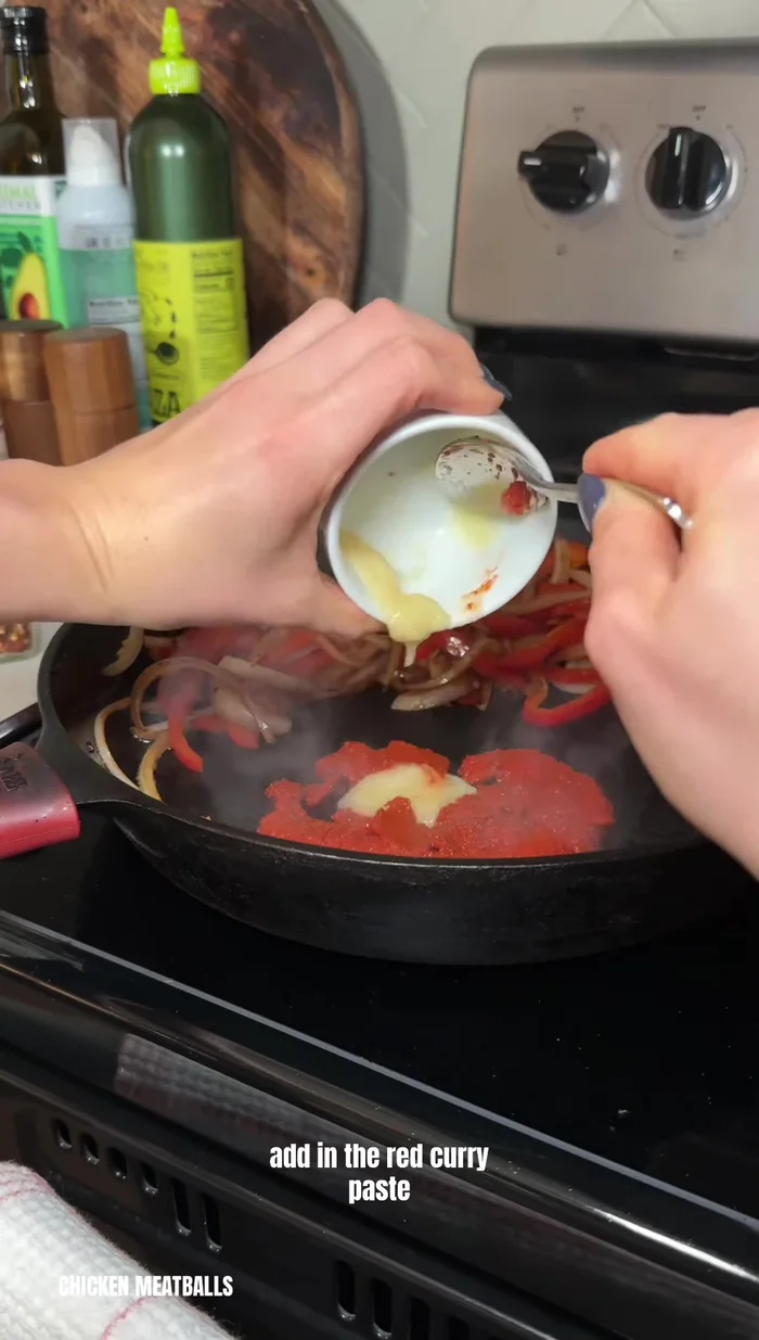 Simmer the meatballs: Add coconut milk, lime juice, coconut aminos, and red pepper flakes to the pan. Return the meatballs to the pan and simmer.