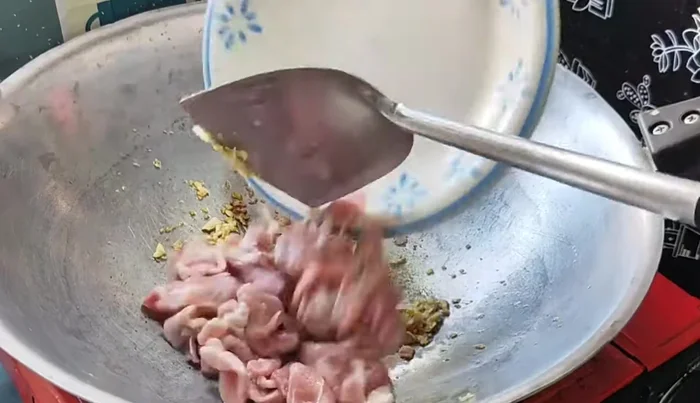 Add the pork and stir-fry until cooked.