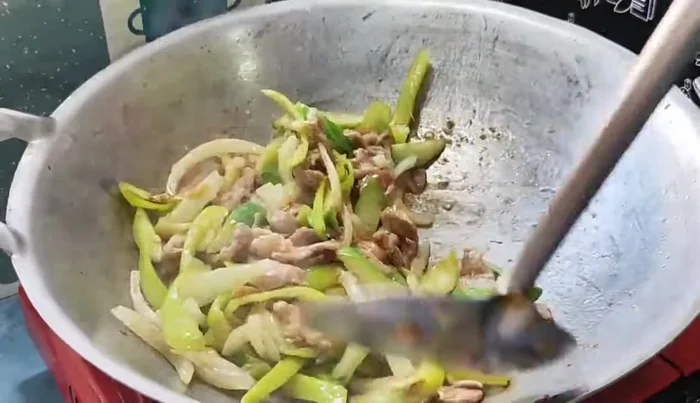 Continue stir-frying until vegetables are cooked through and the sauce has thickened.