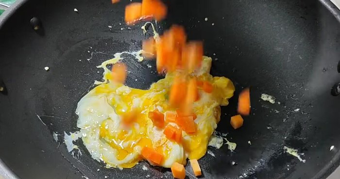 Add the carrots (they take longer to cook).
