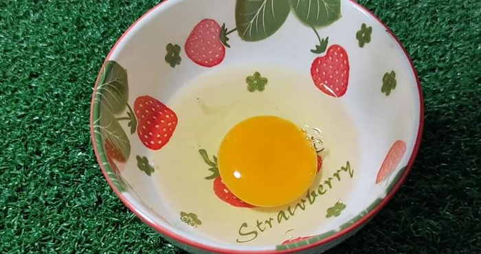 Crack 2 eggs into a cup and set aside.