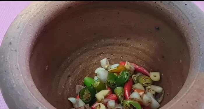 Place all cooked ingredients into a mortar and pestle.
