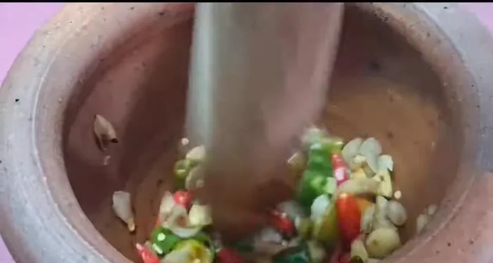 Pound the ingredients until finely ground.
