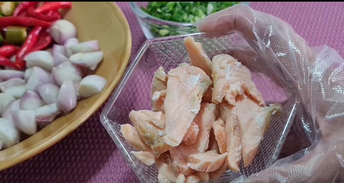 Boil the salmon until cooked.