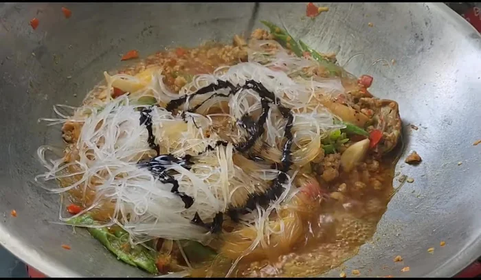 Add light soy sauce and food coloring.