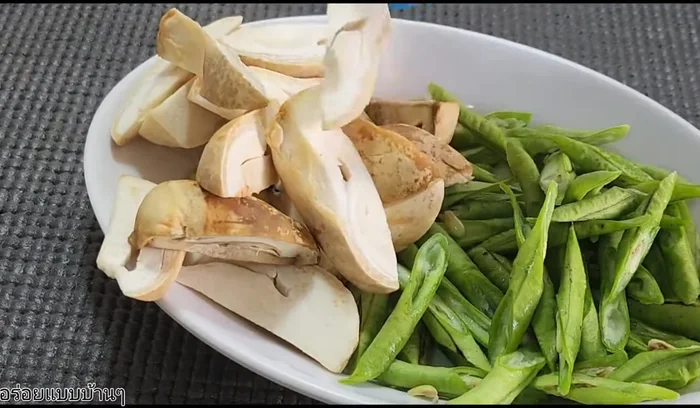 Cut straw mushrooms into bite-sized pieces.