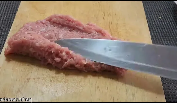 Finely mince the pork (or chicken).