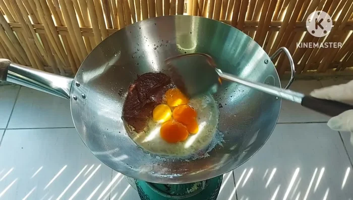 Pour the eggs into the pan. Gently mix until cooked but not fully set.